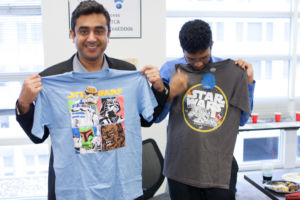A few Star Wars fans checking out their new shirts.